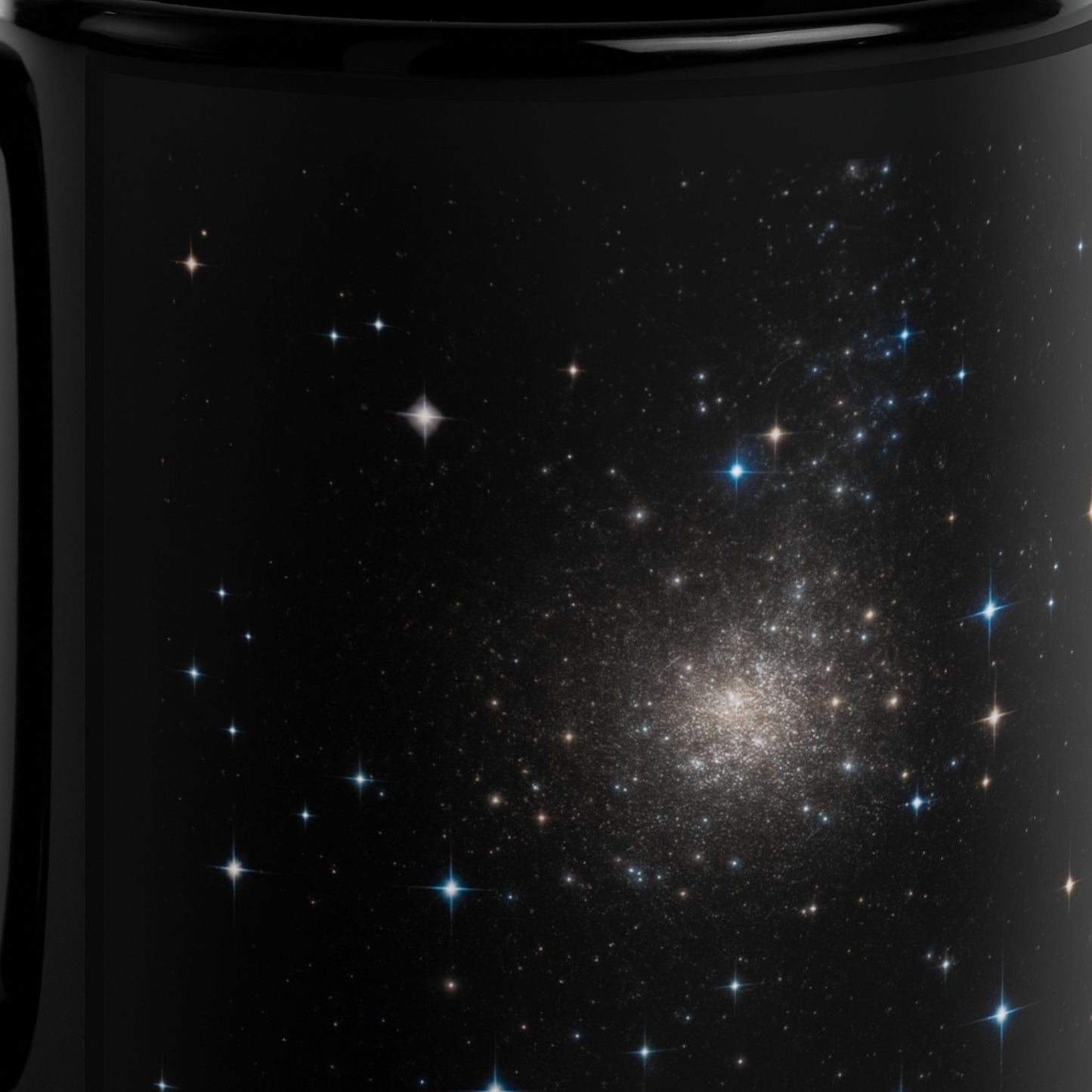 A close-up of the black mug with the starry sky design