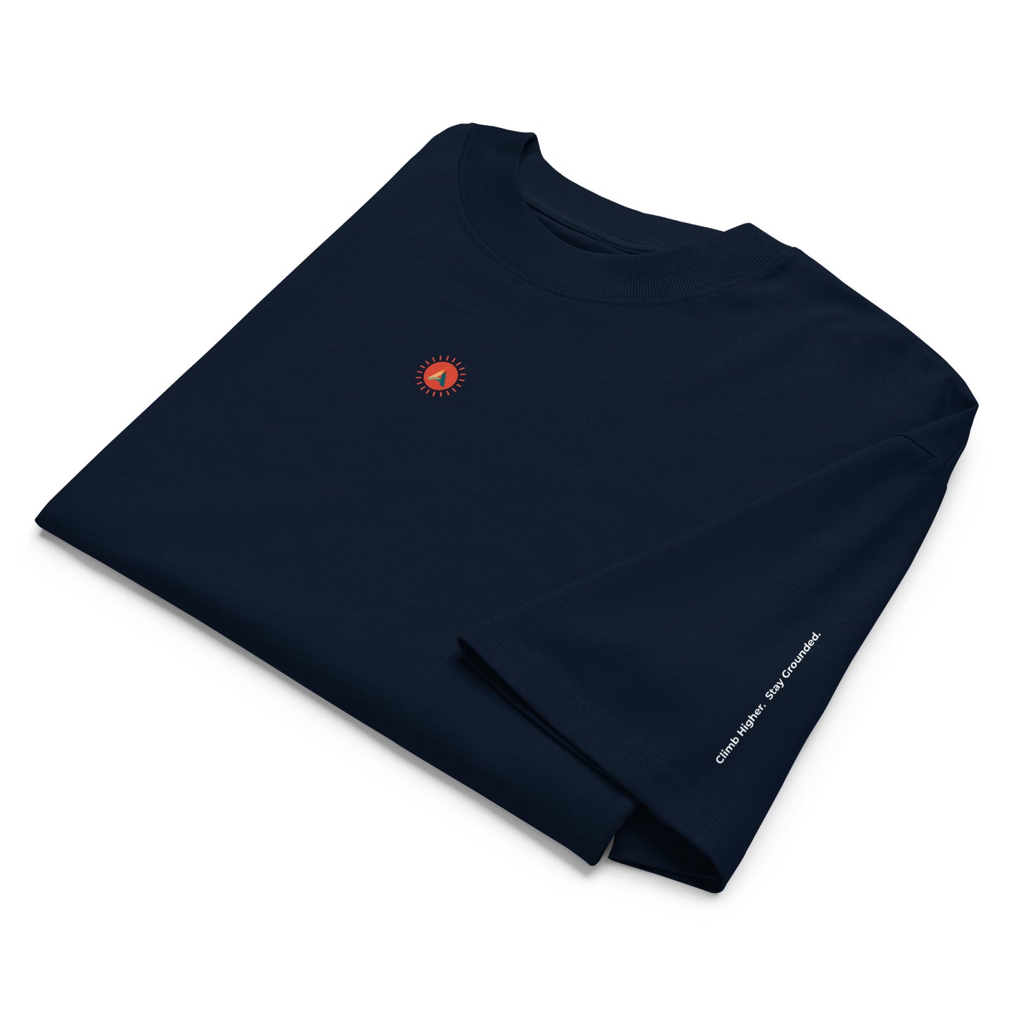 Folded French Navy organic cotton t-shirt with a small Aether Peak Sunburst logo and the phrase "Climb Higher. Stay Grounded." on a white background