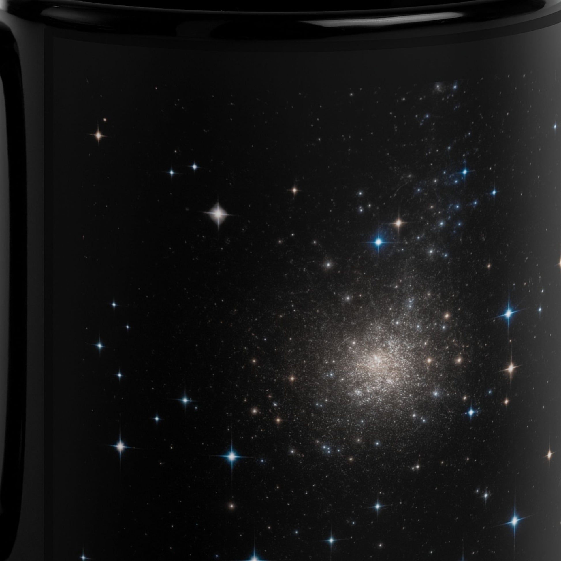 A close-up of the black mug with the starry sky design