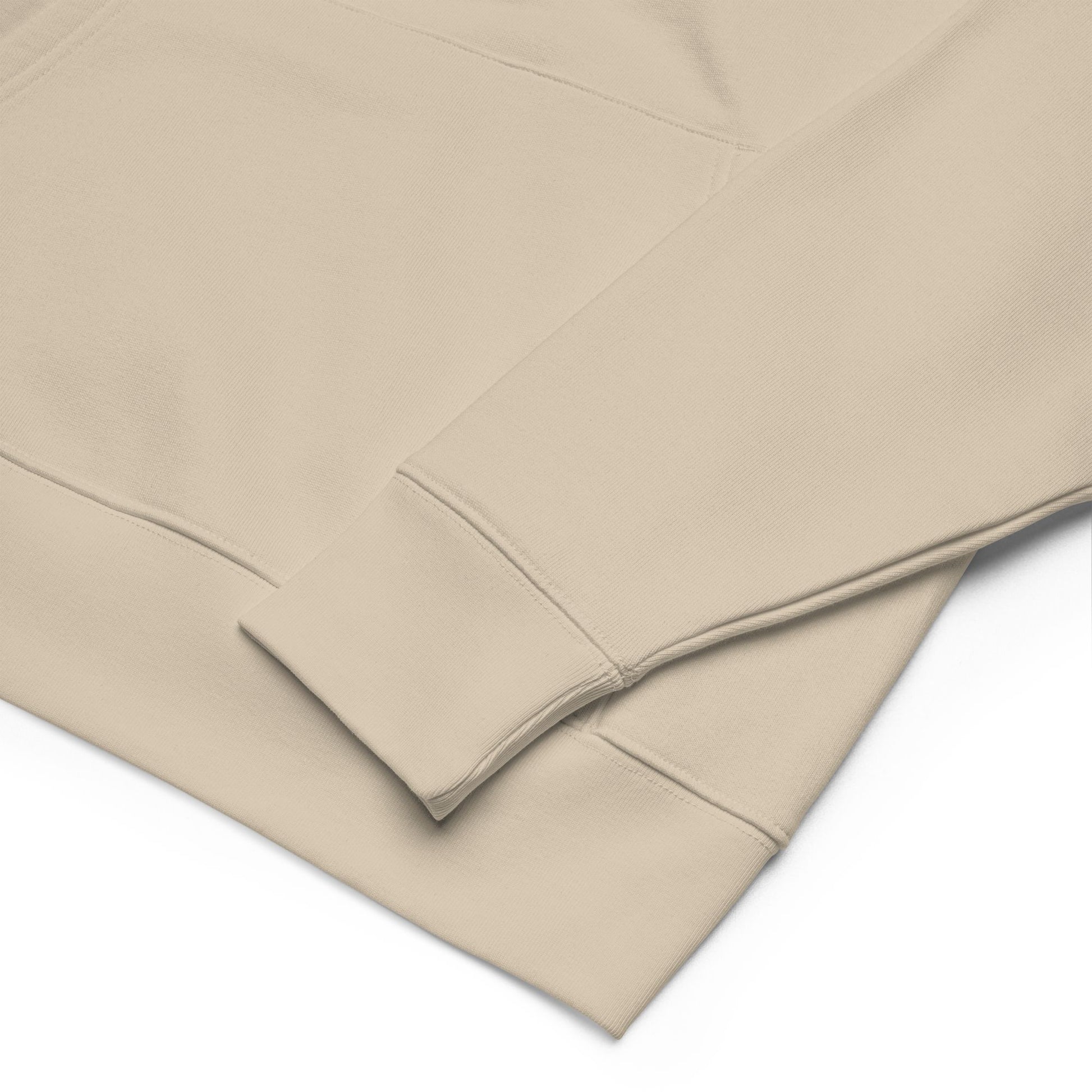 Desert Dust hoodie close up with a subtle texture on a white background