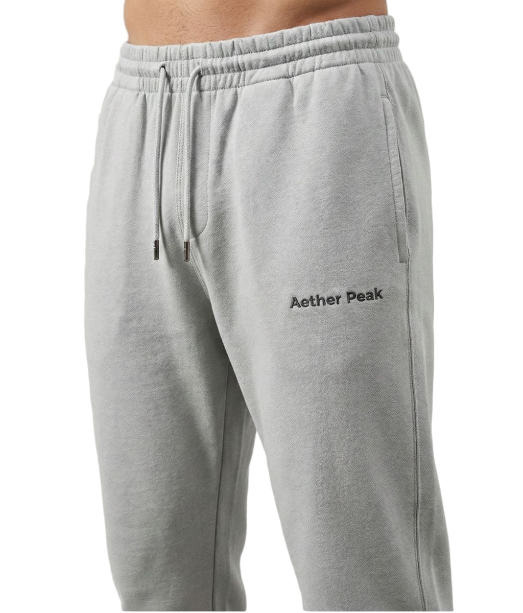 Heather Grey joggers with 'Aether Peak' logo on a white background
