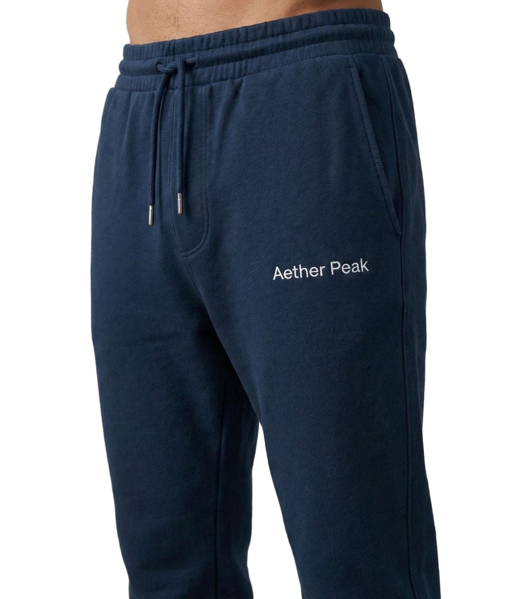 French Navy blue joggers with 'Aether Peak' logo on a white background