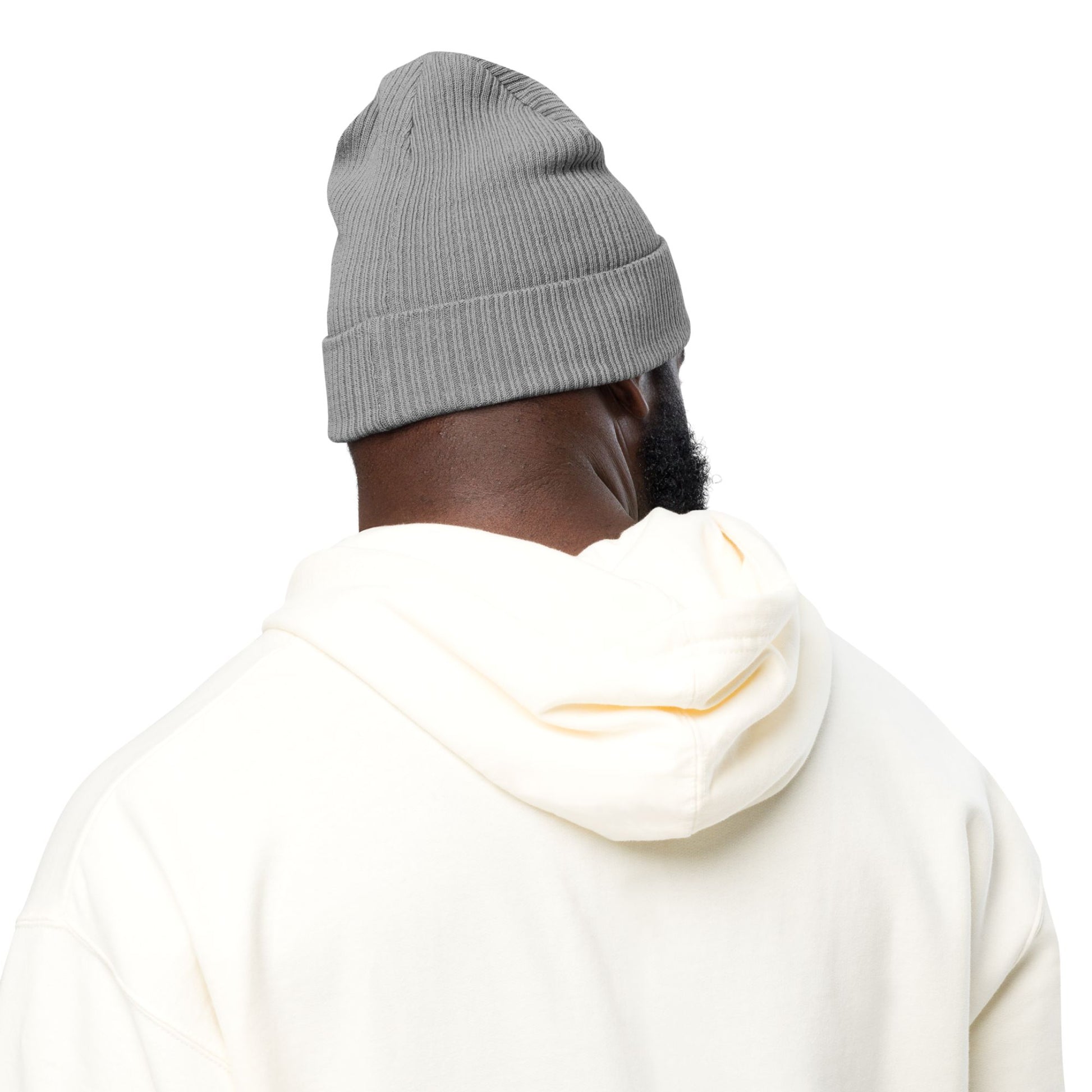 A man wearing a gray beanie and white hoodie on a white background